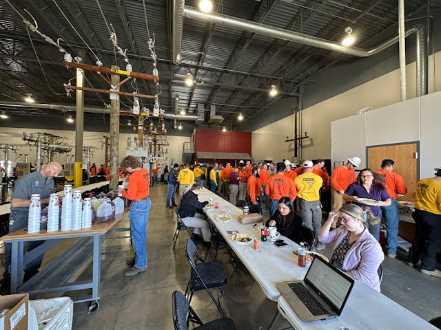 Crowd lines up for lunch at Executive Refreshments customer appreciation event, featuring catered food, ice cream trucks and barista bars.