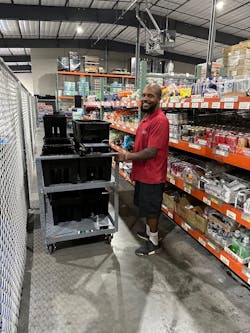 Quality Vending&apos;s Khary Mosby pulling soda.