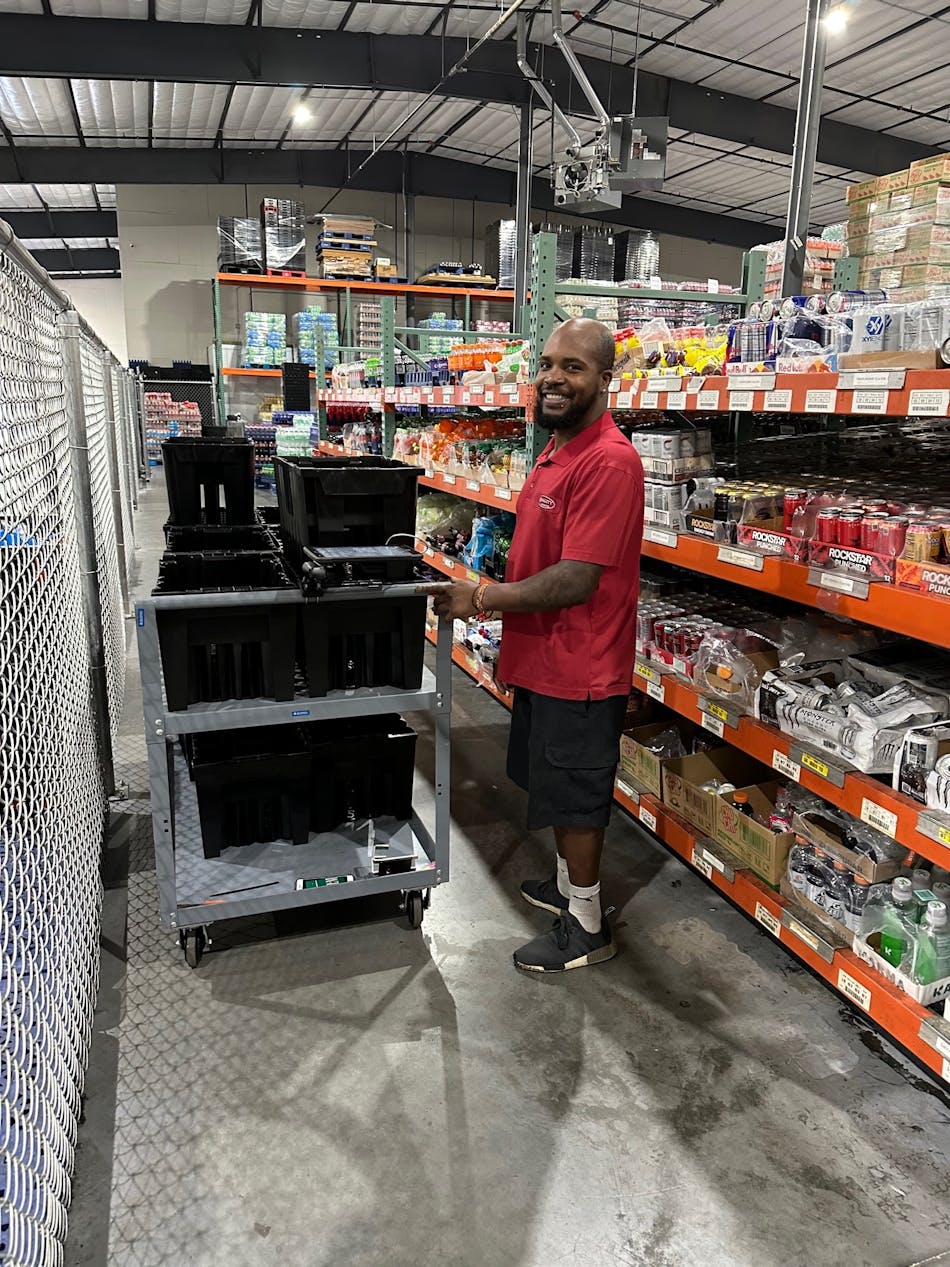 Quality Vending&apos;s Khary Mosby pulling soda.