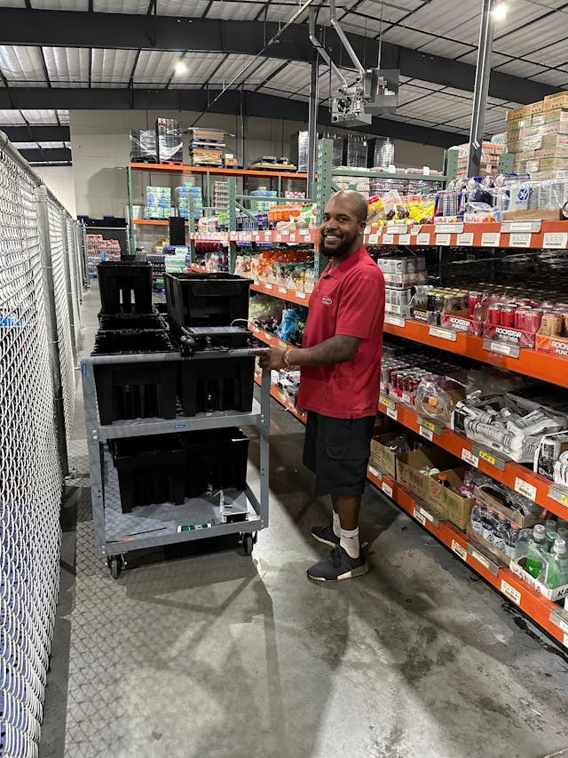 Quality Vending&apos;s Khary Mosby pulling soda.