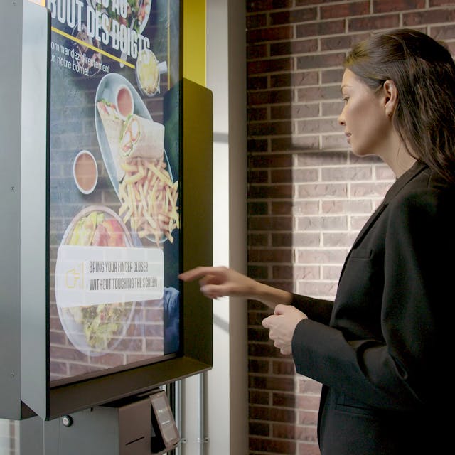 Interactive kiosk combining Samsung digital signage and AIRxTouch technology debuts at St-Hubert restaurant locations in Quebec.